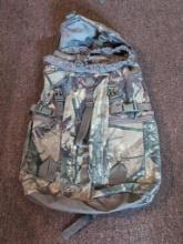 (DEN) FIELDLINE CAMO DUFFLE STYLE CAMPING/HUNTING BACKPACK. GOOD OVERALL CONDITION.