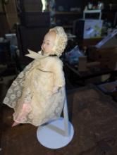 (GAR) Blue Eyed Porcelain Baby Doll with White Dress, Approximately 9" Tall, Appears to be in Good