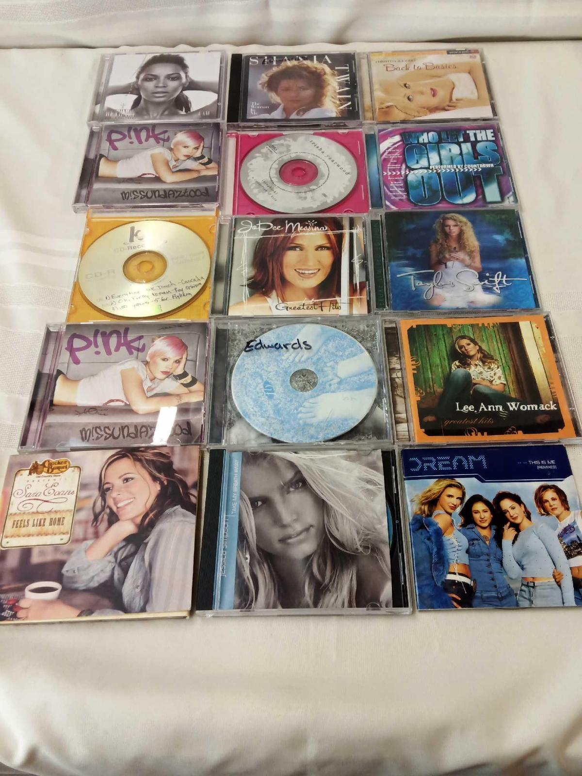 CD LOT WITH VARIOUS ARTISTS AS SHANIA, PINK, LEE ANN WOMACK, TAYLOR SWIFT, AND OTHERS