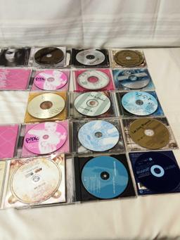 CD LOT WITH VARIOUS ARTISTS AS SHANIA, PINK, LEE ANN WOMACK, TAYLOR SWIFT, AND OTHERS