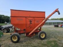 KILBROS GRAVITY WAGON ON NEW HOLLAND 234 RUNNING GEAR WITH HYDRAULIC AUGER,