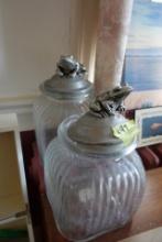 PAIR OF CLEAR GLASS CANISTERS WITH BULL FROG TOPS