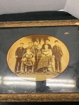 early black-and-white photo of the family on board