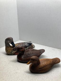 Brass pheasant and three duck decoys one signed