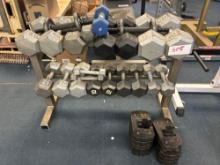 Metal dumbbell weightlifting rack. 5 pounds to 40 pound dumbbells. and 10 pound weight add ons