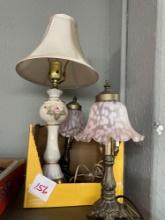 Three lamps one capodimonte, the other two matching lilac ruffled glass shades, brass bottom