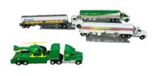 Four Various Diecast Semi Trucks one with Helicopter