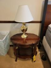 Vintage oval top side table with brass lamp