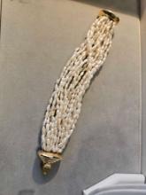 Lady's 14k yellow gold nineteen strand freshwater pearl bracelet