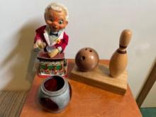Early Bartender Wind Up Toy, Carved Wood Bowling Ball and Pin Decor, and early railroad red glass