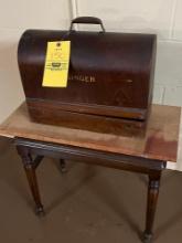 early singer sewing machine , small table , with key