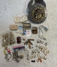 Tin of misc jewelry, rings, pins, bracelets
