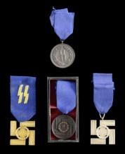 4 WWII STYLE GERMAN SS LONG SERVICE MEDALS.