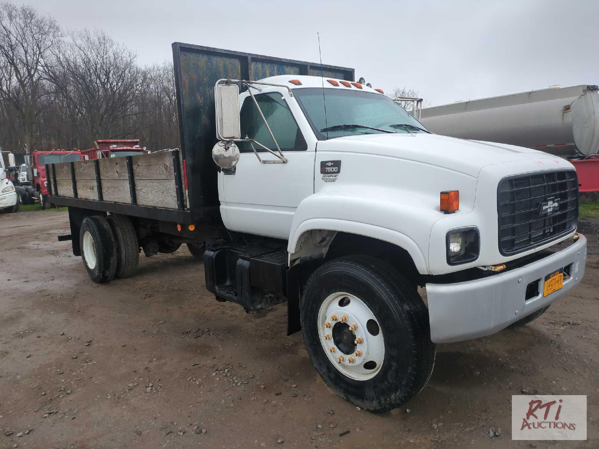 1999 Chevy C7500 16ft stake body dump, dual axles, air brakes, Chelsea PTO, 5 speed transmission,